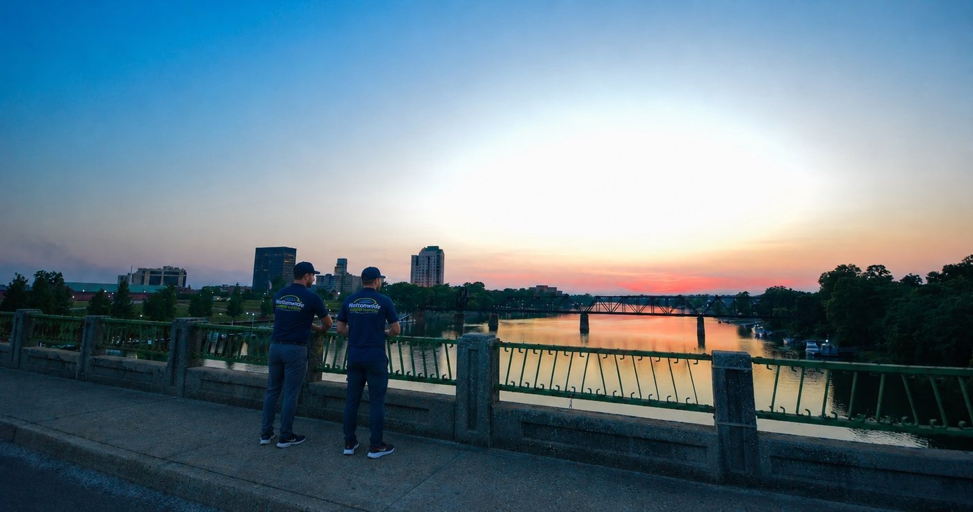 Nationwide Carpet Cleaning team overlooking the Savannah River and downtown Augusta, GA skyline